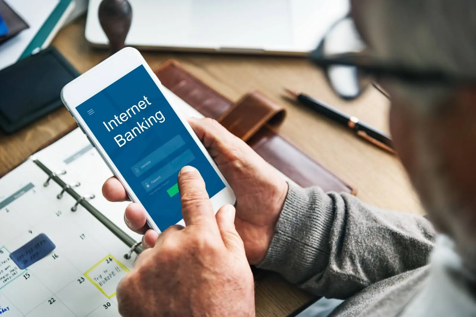 A customer using a mobile banking app for a secure digital transaction