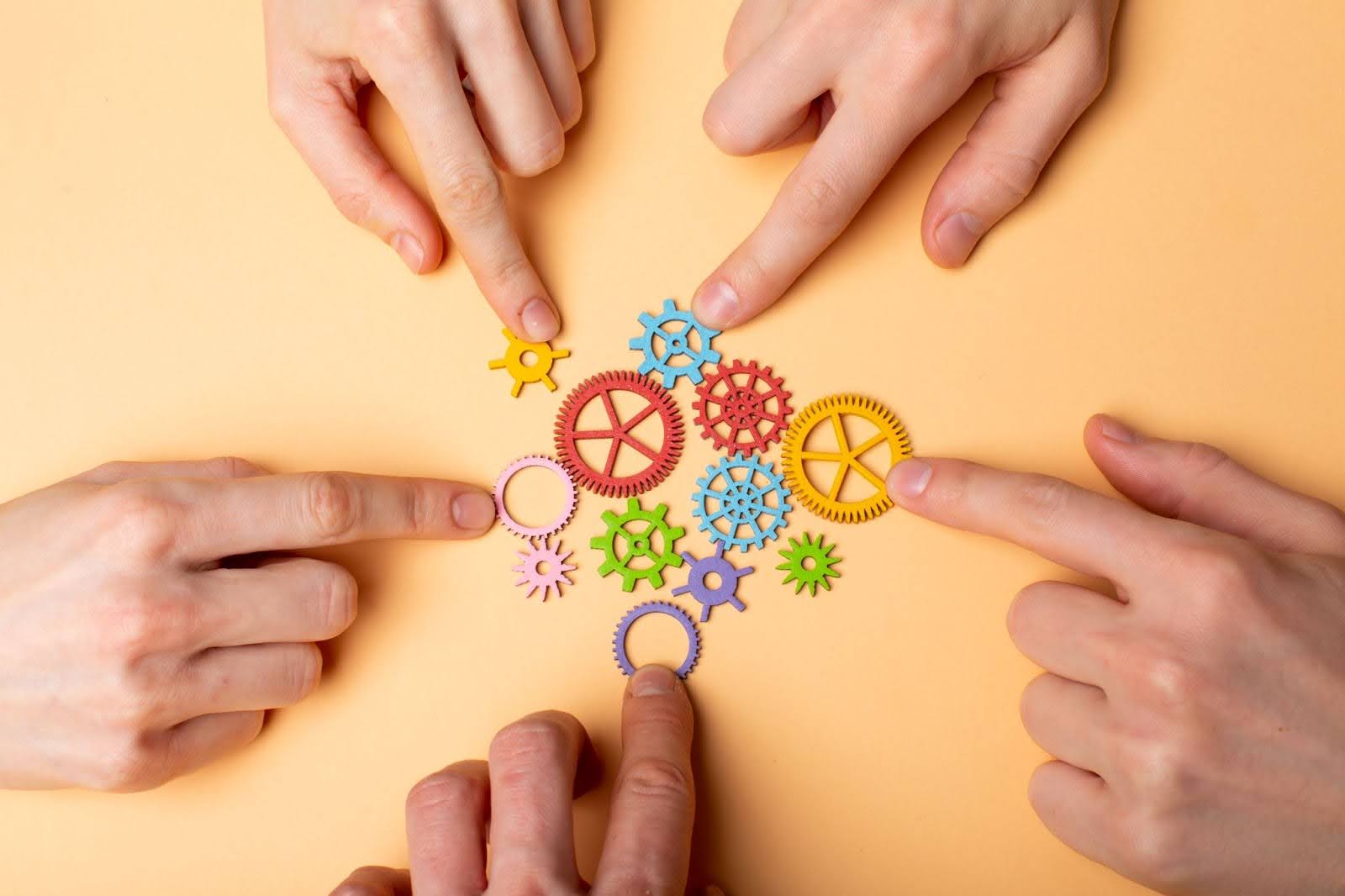 Agile fintech teamwork concept with interconnected gears symbolising collaborative delivery