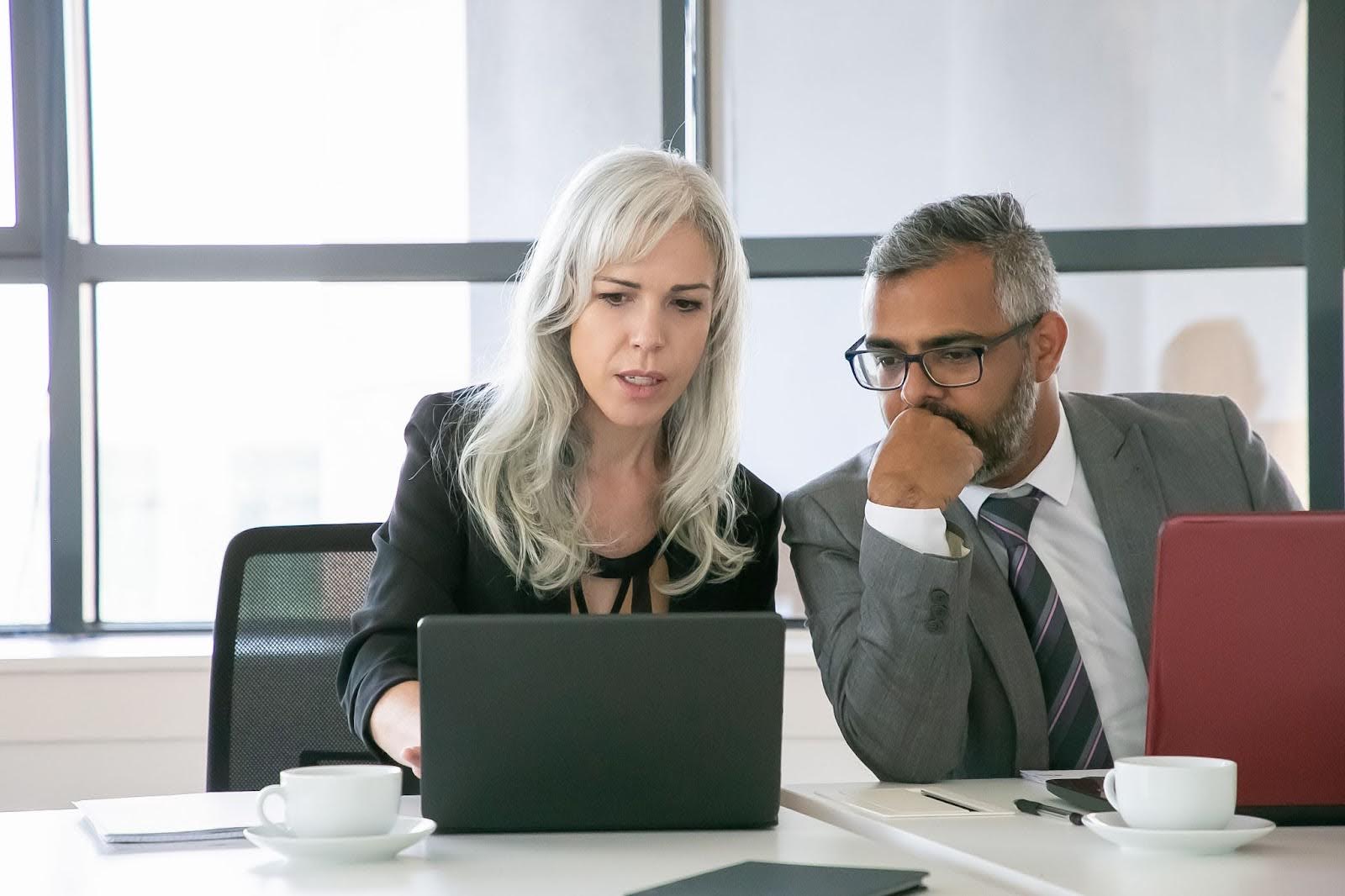 Fintech project manager presenting compliance-ready agile delivery strategy to senior leadership